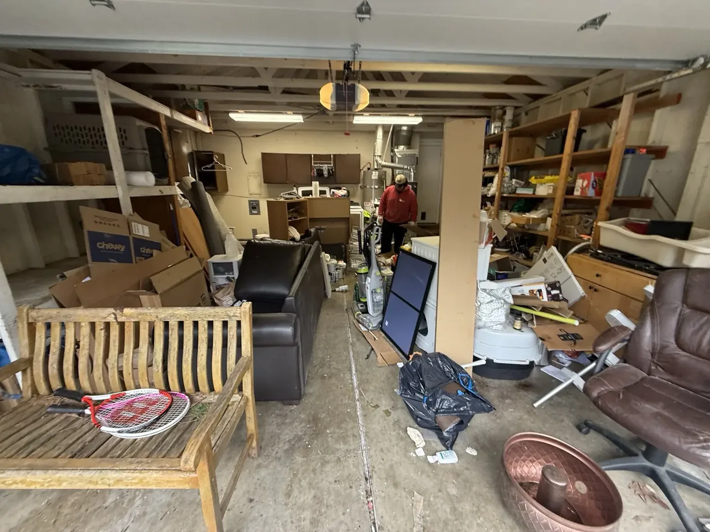 Same garage before removal, with furniture, boxes and household contents