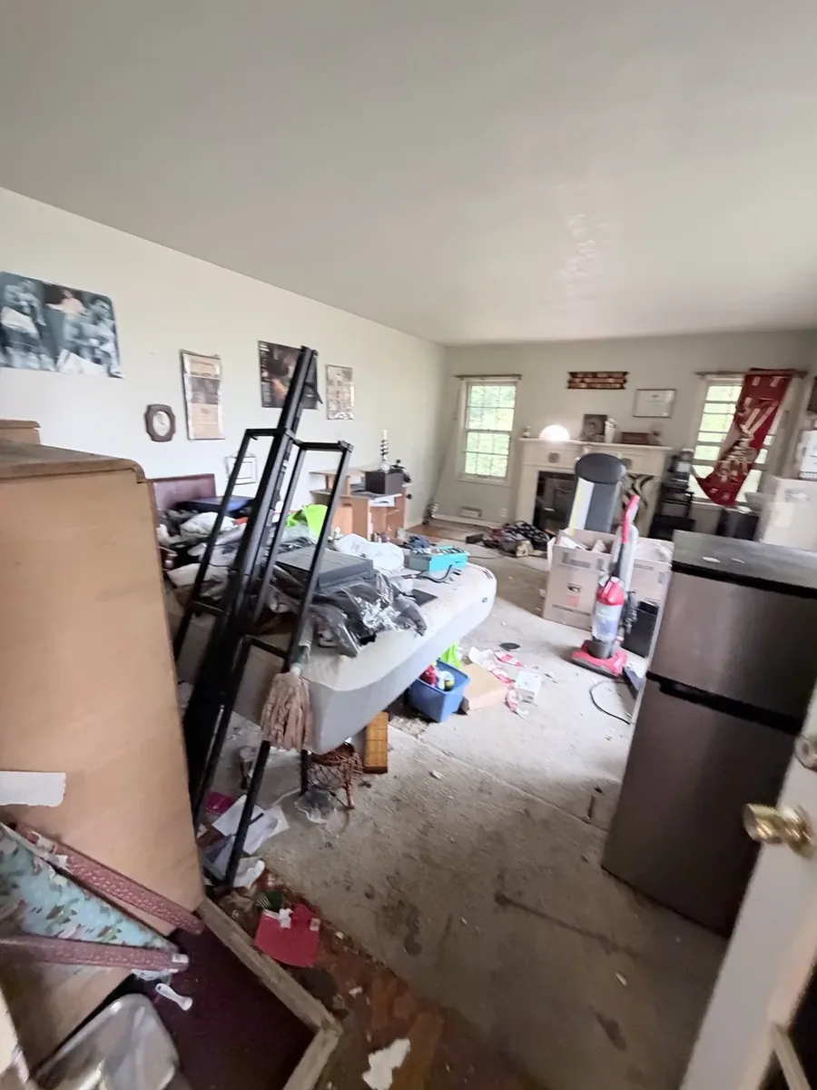 Living room with furniture and belongings before a JunkPDX cleanout